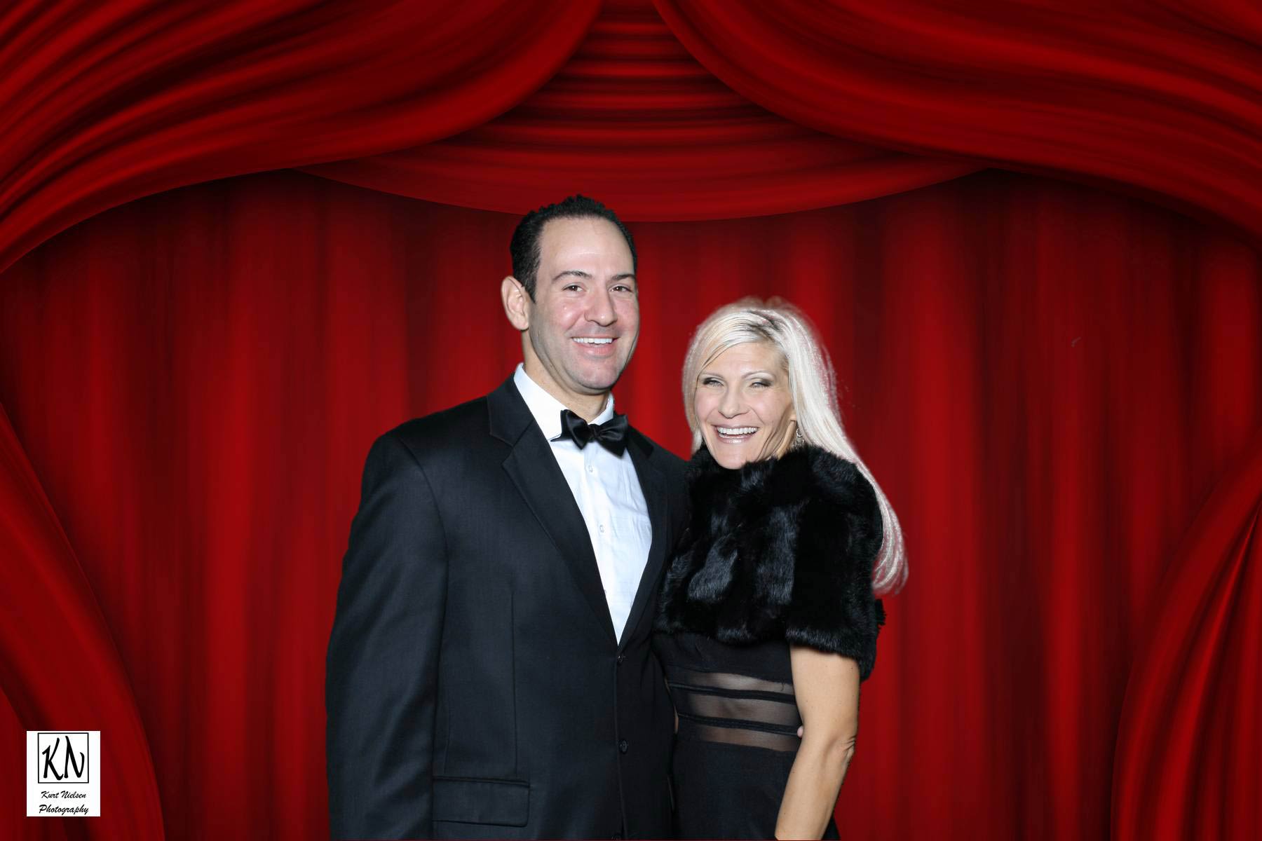 tony geftos from 13abc posing with his wife in our green screen photo booth for a charity gala
