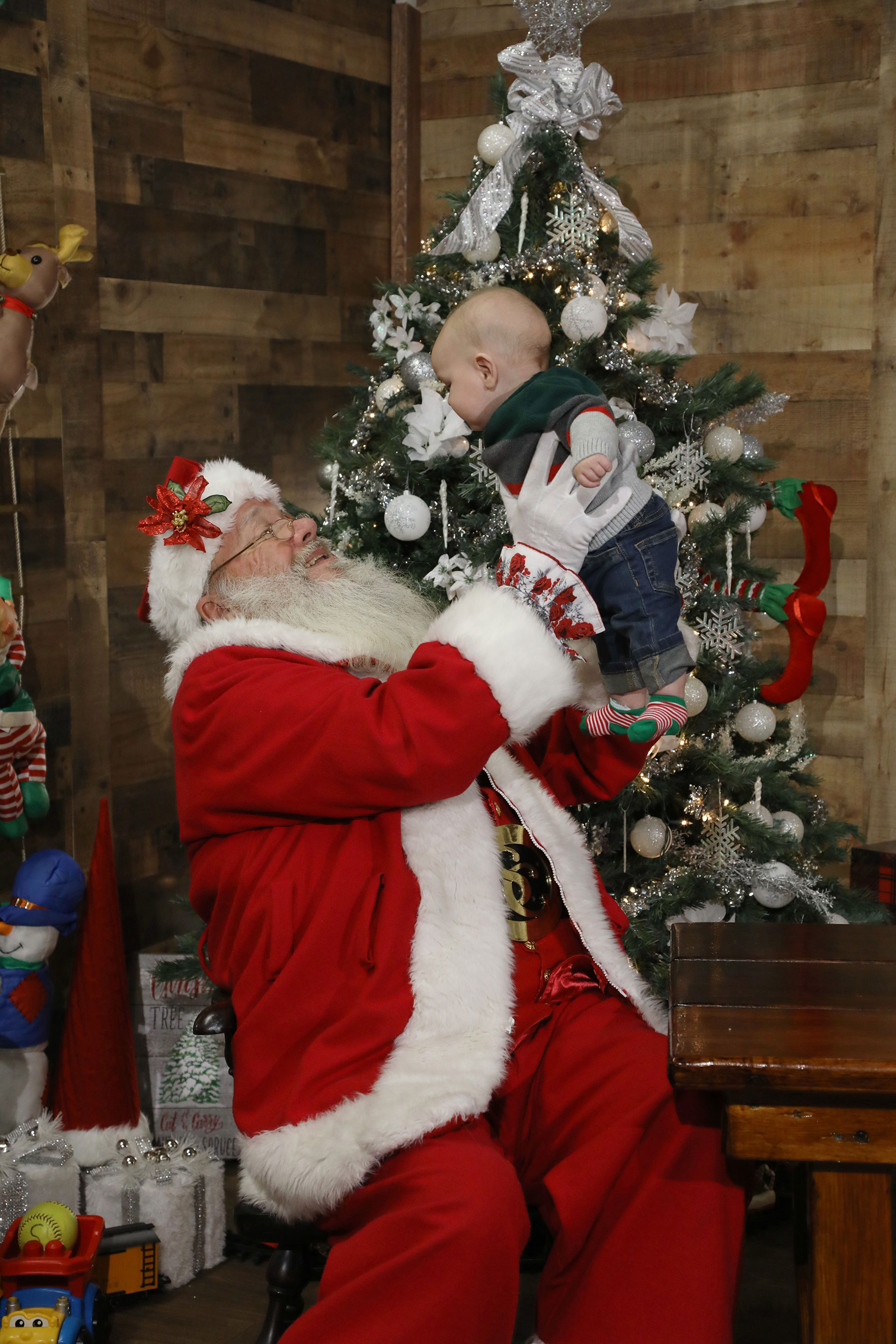 Santa holding up a baby boy