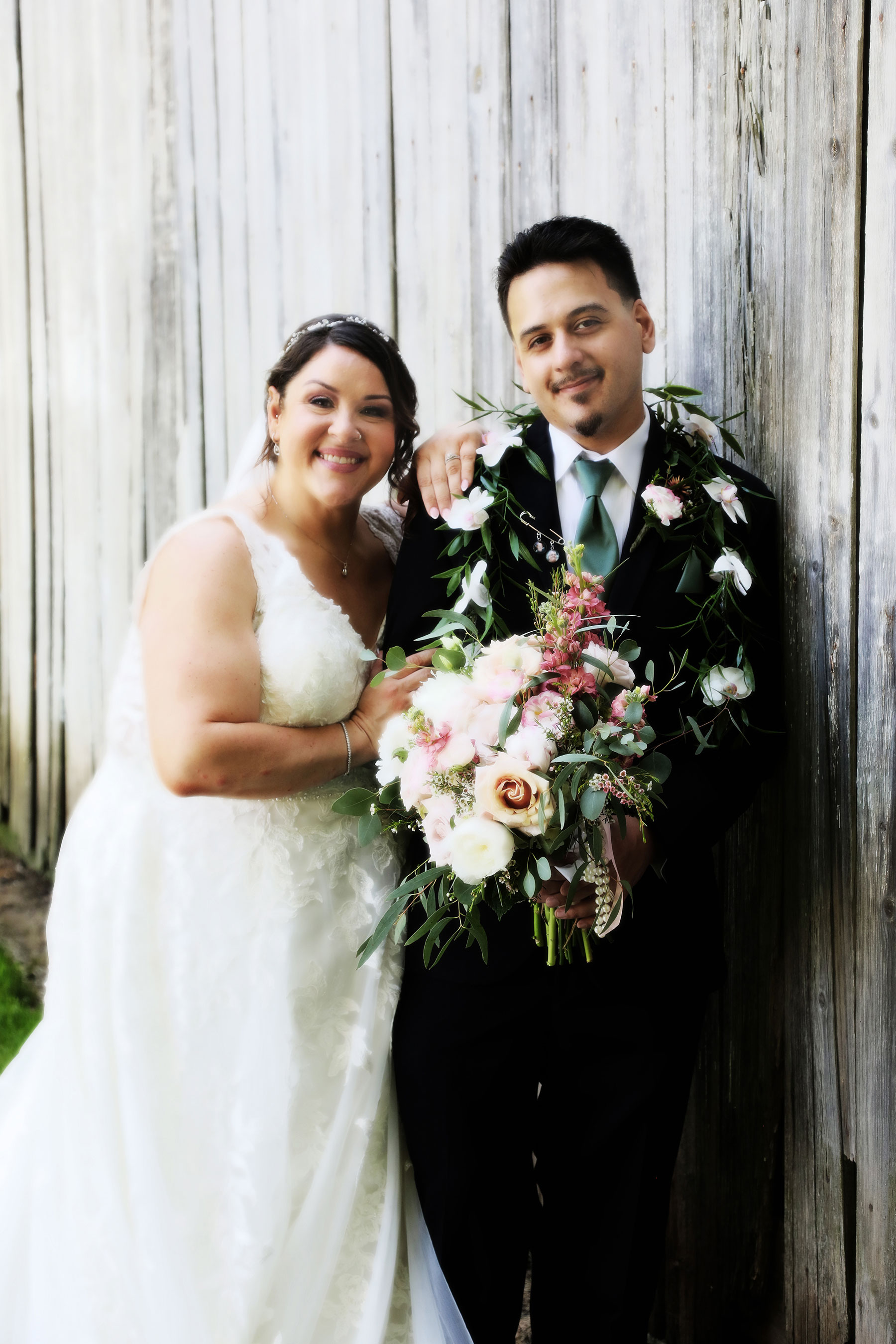 Monclova Wedding Photographer -  newly married couple posing for bridal portraits outside of the Monclova Community Center